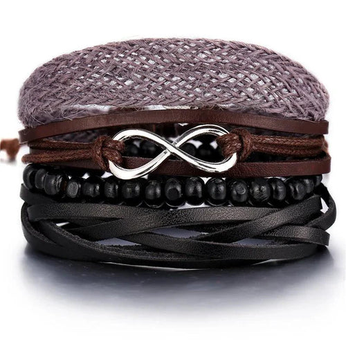 Layered leather charm bracelet by MANDOTOS featuring multiple leather strands and metal charm accents.