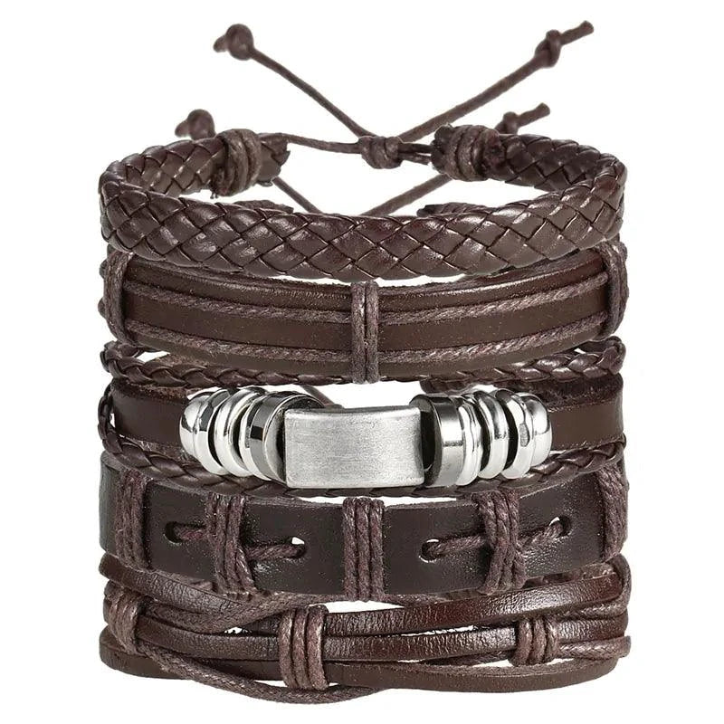 Layered leather charm bracelet by MANDOTOS featuring multiple leather bands and metal charms on a neutral background.