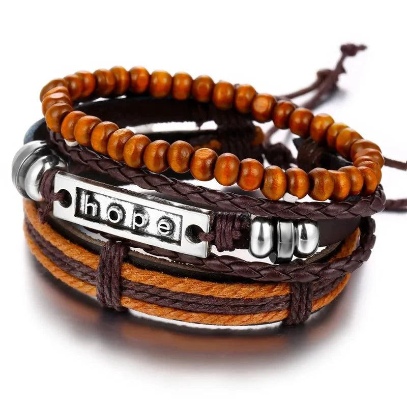 Layered leather charm bracelet by MANDOTOS with metal and bead accents, styled with multiple leather straps.