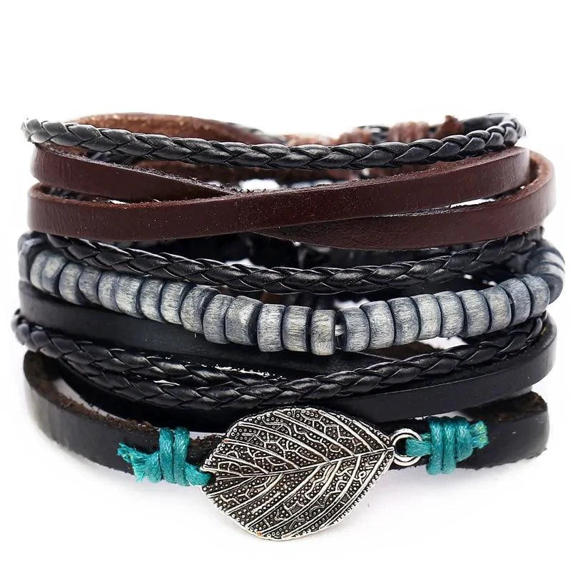 Layered leather charm bracelet by MANDOTOS featuring multiple leather strands and decorative metal charms.