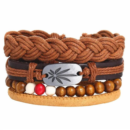Layered leather charm bracelet by MANDOTOS featuring multiple leather strands and decorative metal charms.