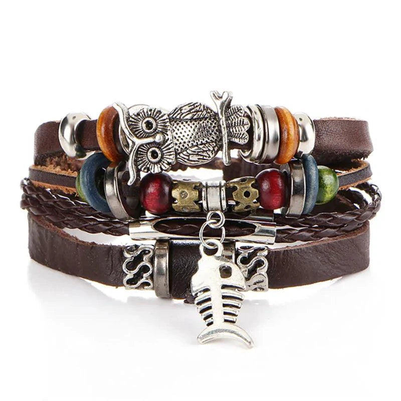 Layered leather charm bracelet by MANDOTOS with metal and bead accents, featuring multiple leather straps and decorative charms.