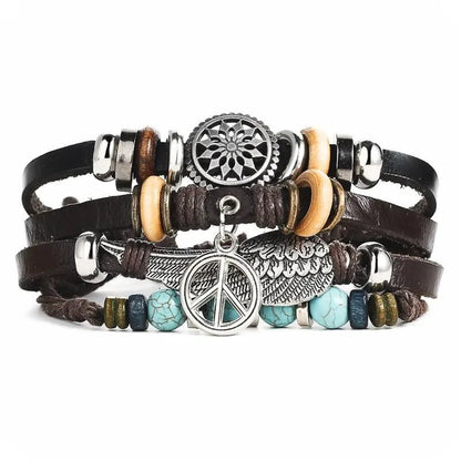 Layered leather charm bracelet by MANDOTOS featuring multiple leather strands and decorative charms on a neutral background.