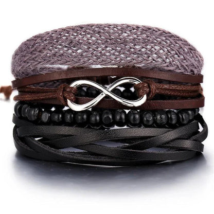 Layered leather charm bracelet by MANDOTOS featuring multiple leather bands and decorative metal charms.