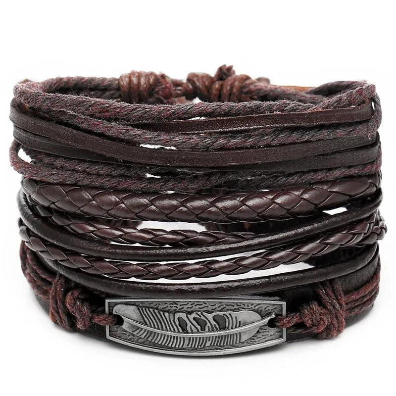 Layered leather charm bracelet by MANDOTOS featuring multiple leather straps and metal charms for a stylish accessory.