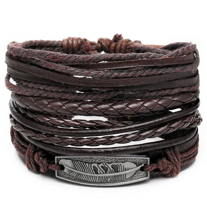 Layered leather charm bracelet by MANDOTOS featuring multiple leather straps and metal charms for a stylish accessory.
