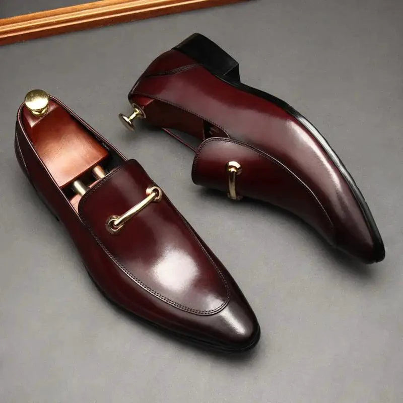 Black leather men's loafers from MANDOTOS with a classic slip-on design and smooth finish.