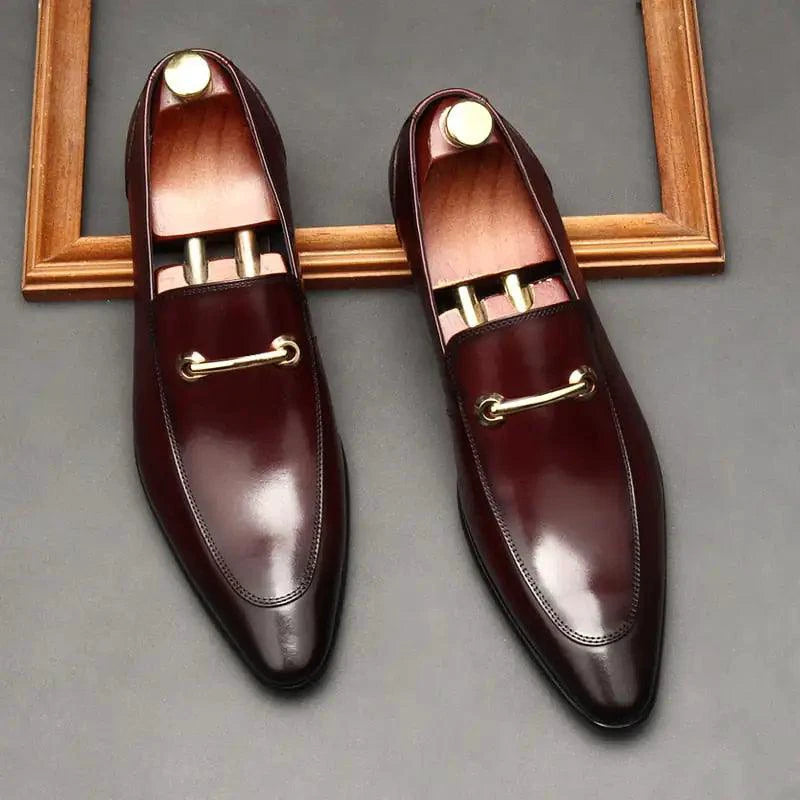Mandotos men's leather loafers featuring classic slip-on design and sleek brown finish, suitable for casual and formal wear.
