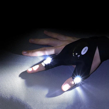 Mandotos LED fingerless adventure glove with built-in LED lights, black fabric, and adjustable wrist strap for outdoor activities.