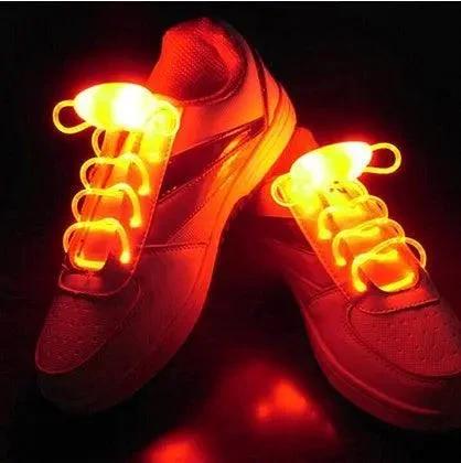 Mandotos LED light-up shoelaces glowing in the dark, colorful and flexible shoe laces for sports and casual footwear.