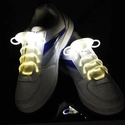 Mandotos LED light-up shoelaces glowing in the dark, vibrant and flexible for athletic or casual shoes.