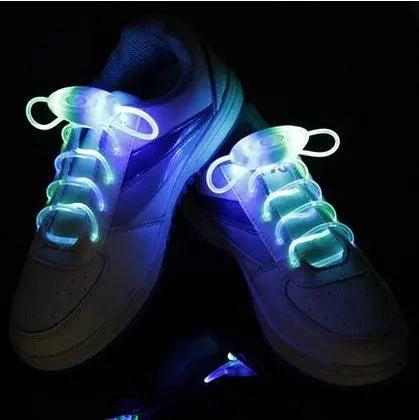 Mandotos LED light-up shoelaces glowing in the dark, flexible and vibrant for customizable footwear.