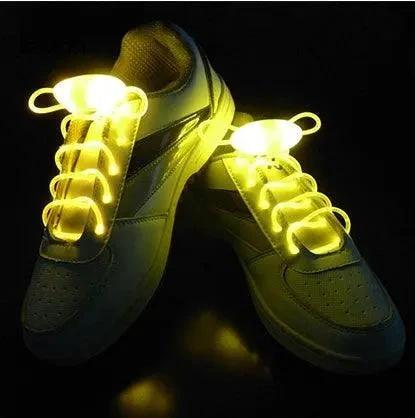 Mandotos LED light-up shoelaces glowing in the dark, colorful and flexible for customizable footwear.