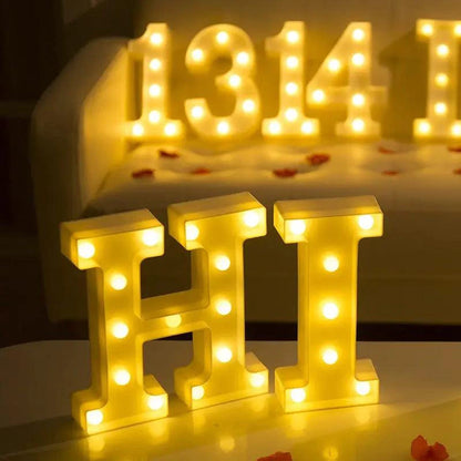 Mandotos luminous letter lights spelling out "LOVE" on a wooden surface, ideal for home decor and ambient lighting.