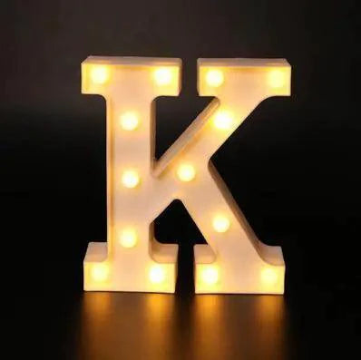 Mandotos luminous letter lights spelling out a word, mounted on a wall with a warm ambient glow, ideal for room decor.