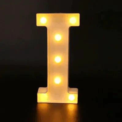 Mandotos luminous letter lights spelling out decorative letters on a wall with a warm glow.