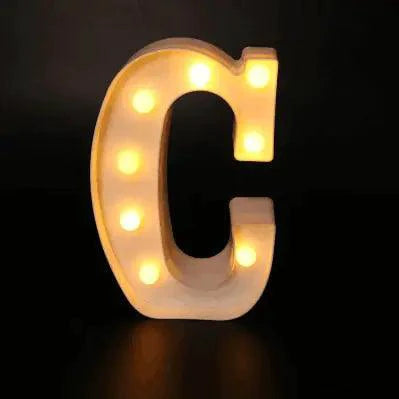 Mandotos luminous letter lights spelling out words, illuminated with warm glow, ideal decorative lighting for rooms or events.