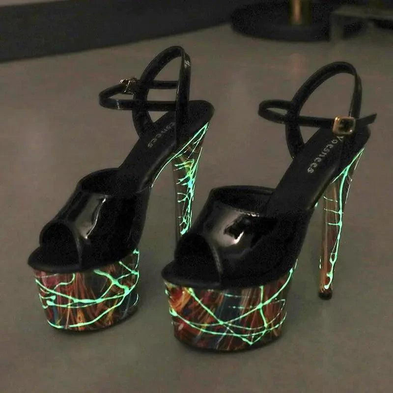 Mandotos lustrous leather stiletto heels with pointed toes and sleek design, perfect for elegant evening wear.