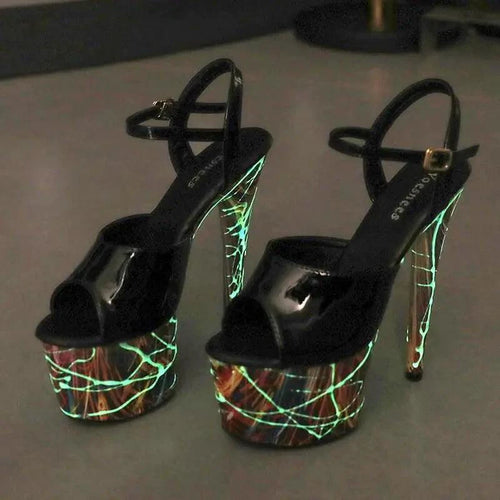 Mandotos lustrous leather stiletto heels with pointed toes and sleek design, perfect for elegant evening wear.