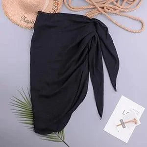 Mandotos LuxeWave chiffon beach wrap draped over a model, showcasing its lightweight, chic, and versatile cover-up design.