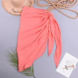 Mandotos LuxeWave chiffon beach wrap draped over a model, showcasing its lightweight, chic, and versatile cover-up design for beach style.