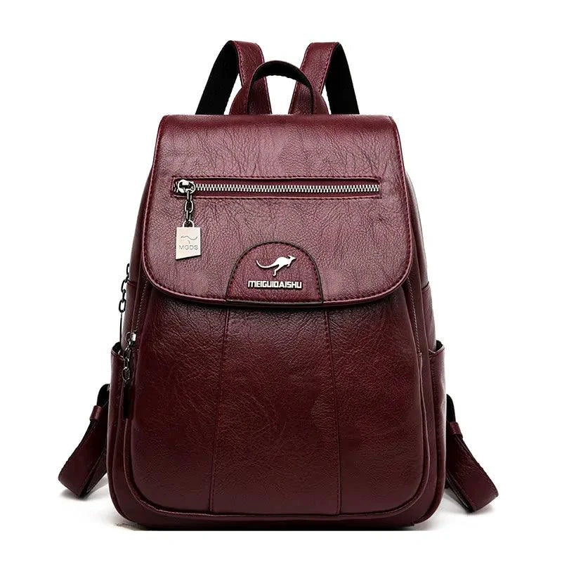 Mandotos luxury embossed leather backpack with sleek design, top handle, and adjustable shoulder straps featuring textured leather surface.