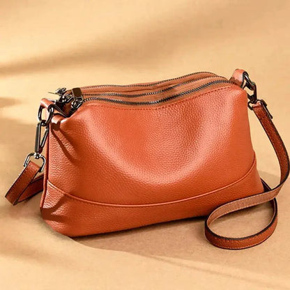 Elegant genuine leather handbag by MANDOTOS featuring a sleek design and high-quality craftsmanship.