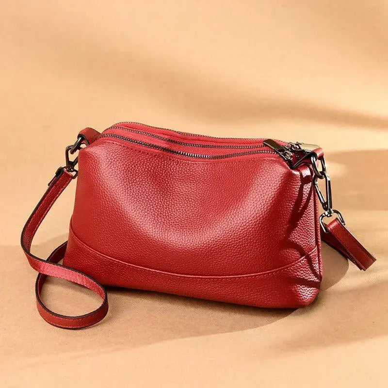 Mandotos luxury genuine leather handbag with sleek design, featuring sturdy handles and elegant craftsmanship.