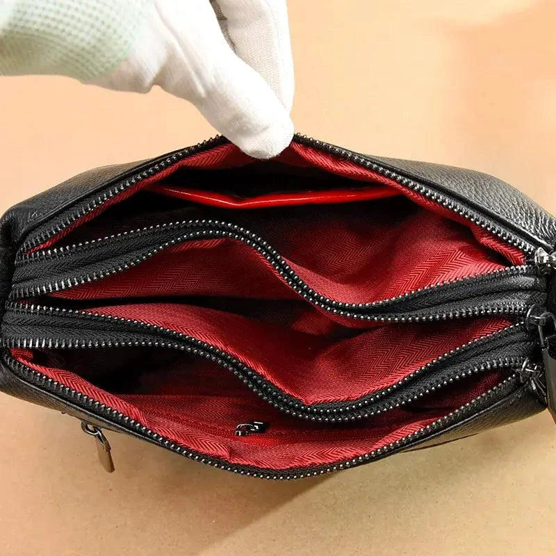 Luxury genuine leather handbag by MANDOTOS, featuring sleek design and high-quality craftsmanship in a stylish accessory.
