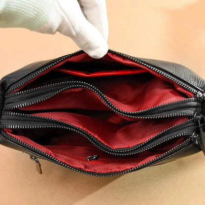 Luxury genuine leather handbag by MANDOTOS, featuring sleek design and high-quality craftsmanship in a stylish accessory.