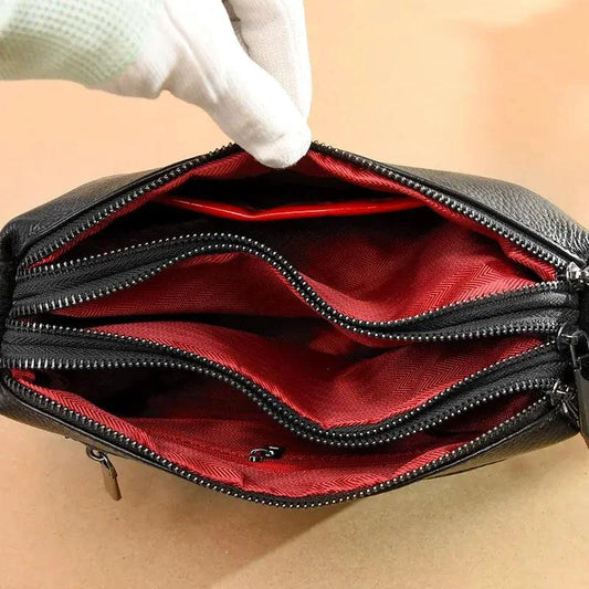 Luxury genuine leather handbag by MANDOTOS, featuring sleek design and high-quality craftsmanship in a stylish accessory.