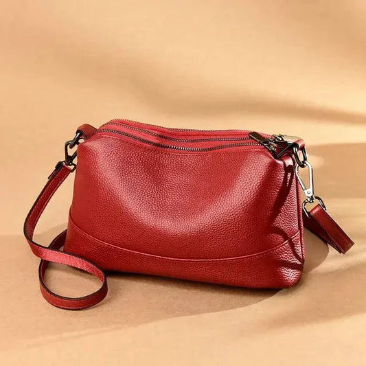 Luxury genuine leather handbag by MANDOTOS featuring a sleek design and high-quality craftsmanship.