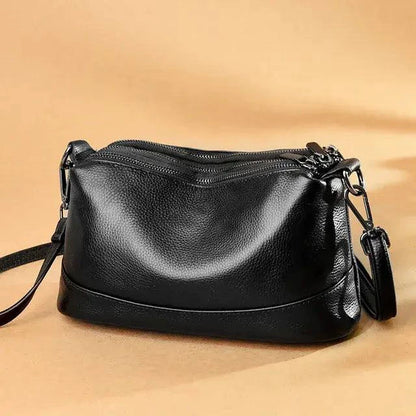 Luxury genuine leather handbag by MANDOTOS featuring a sleek design and elegant craftsmanship.