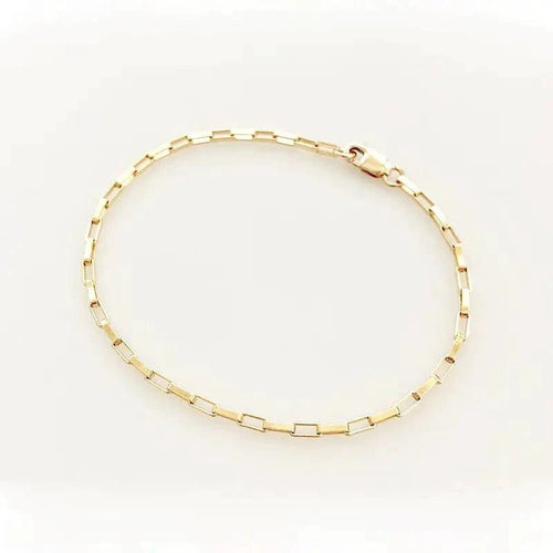 Handcrafted luxury gold chain bracelet by MANDOTOS with intricate links and polished finish, stylish and elegant jewelry accessory.