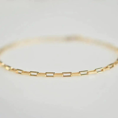 Handcrafted luxury gold chain bracelet by MANDOTOS featuring a sleek, elegant design with intricate links.