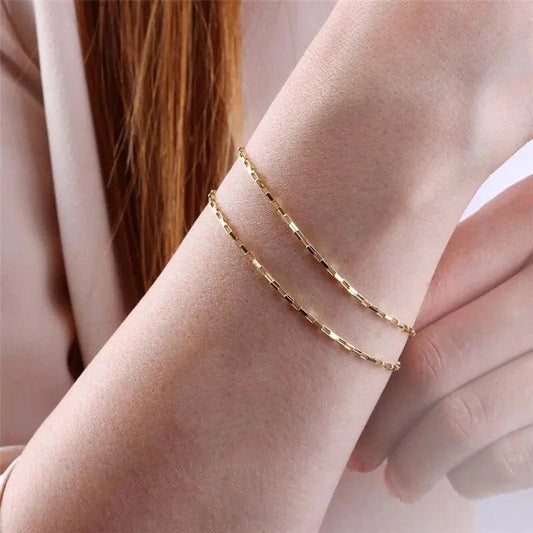 Handcrafted luxury gold chain bracelet by MANDOTOS, featuring intricate links and elegant design for sophisticated style.