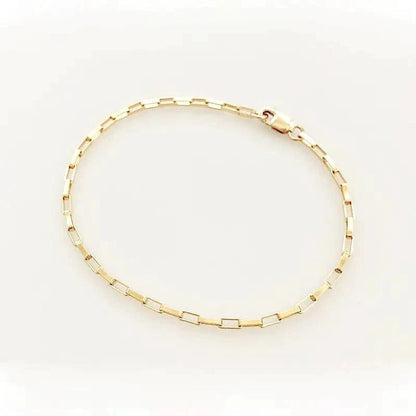 Handcrafted luxury gold chain bracelet by MANDOTOS with intricate links and polished finish, showcasing elegant jewelry craftsmanship.