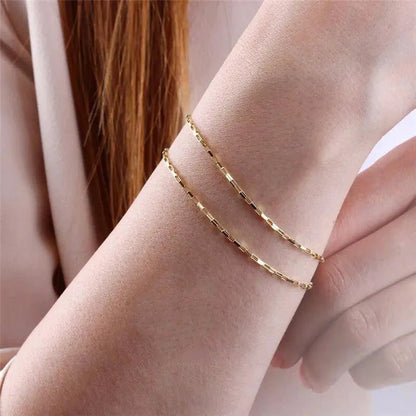 Handcrafted luxury gold chain bracelet by MANDOTOS featuring intricate link design and polished finish.