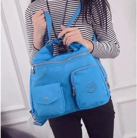 Mandotos luxury women's waterproof designer crossbody handbag with large capacity, beige Bylon cloth, and shoulder strap.