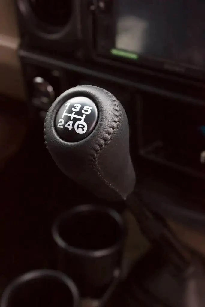 Luxury leather gear shift kit by MANDOTOS featuring a sleek, high-quality leather cover for car gear shifter.