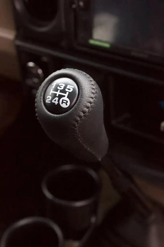 Luxury leather gear shift kit by MANDOTOS featuring a sleek, high-quality leather cover for car gear shifter.