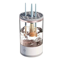 Mandotos makeup brush cleaner bottle with brush cleaning solution, featuring a pump dispenser and cleaning sponge.
