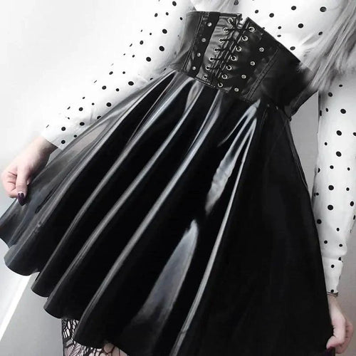 Mandotos black leather lace-up skirt with front lacing and fitted design, displayed on a mannequin.