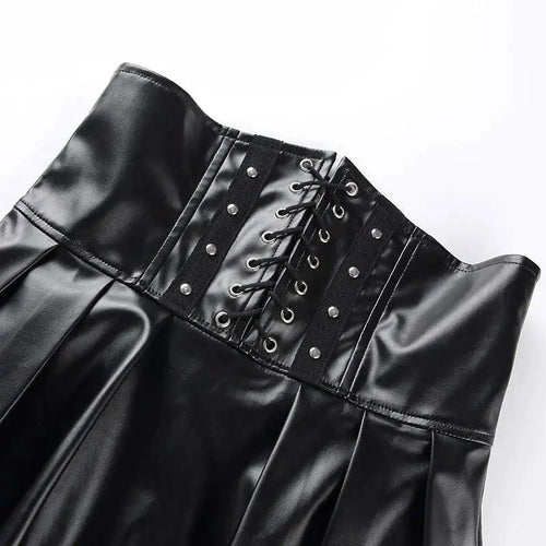 Mandotos black leather lace-up skirt with front lacing and sleek design, shown on a model.
