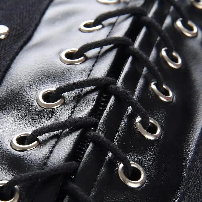 Mandotos black leather lace-up skirt with front lacing detail, fitted style, and high waist, perfect for edgy fashion looks.