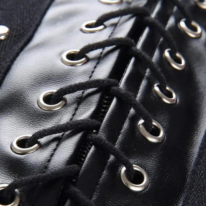 Mandotos black leather lace-up skirt with front lacing detail, fitted style, and high waist, perfect for edgy fashion looks.