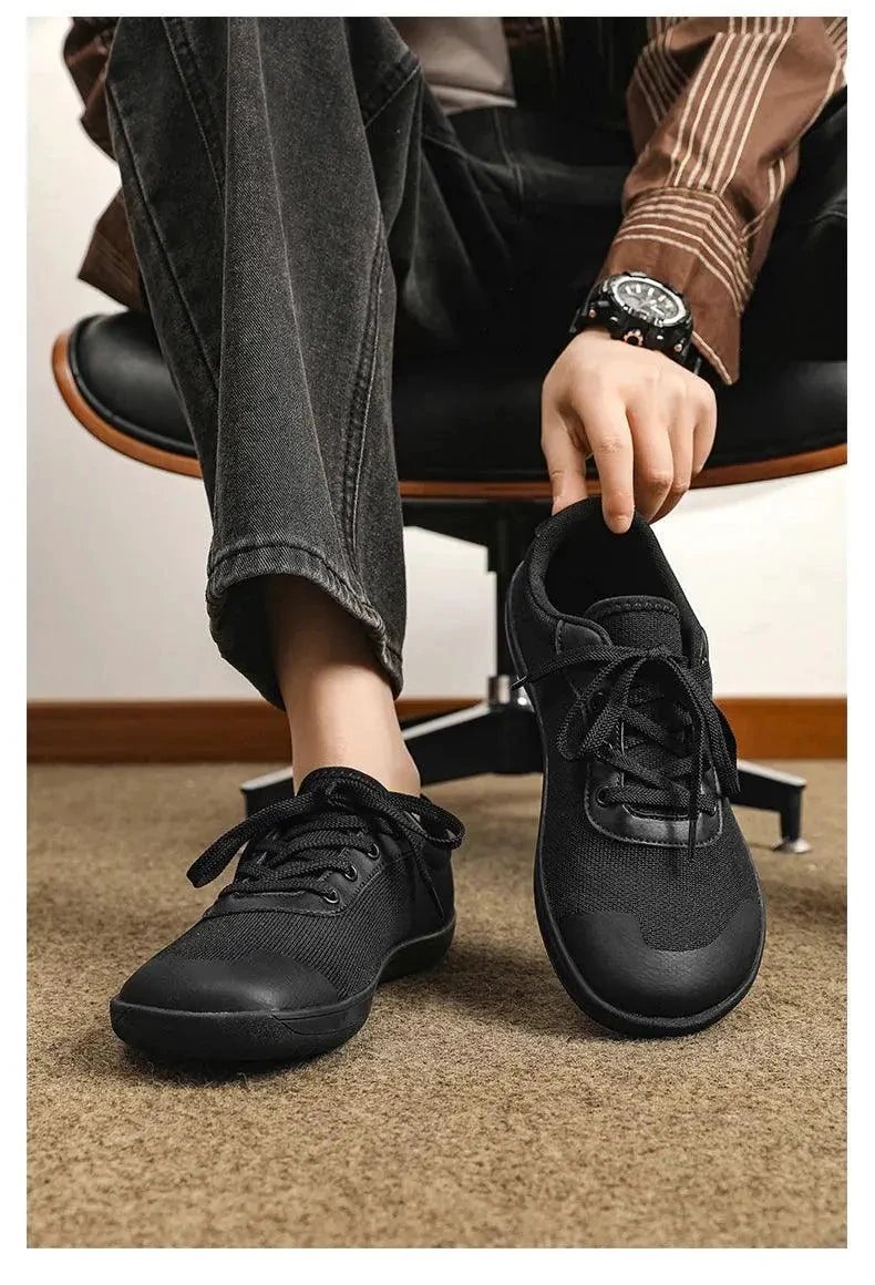 Mandotos men's breathable wide toe mesh running shoes with lightweight responsive sole for comfortable support.