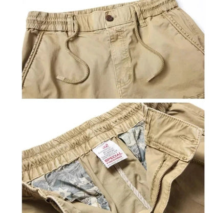Mandotos men's gray cotton tactical cargo pants with full-length design, featuring multiple pockets and military-inspired style.
