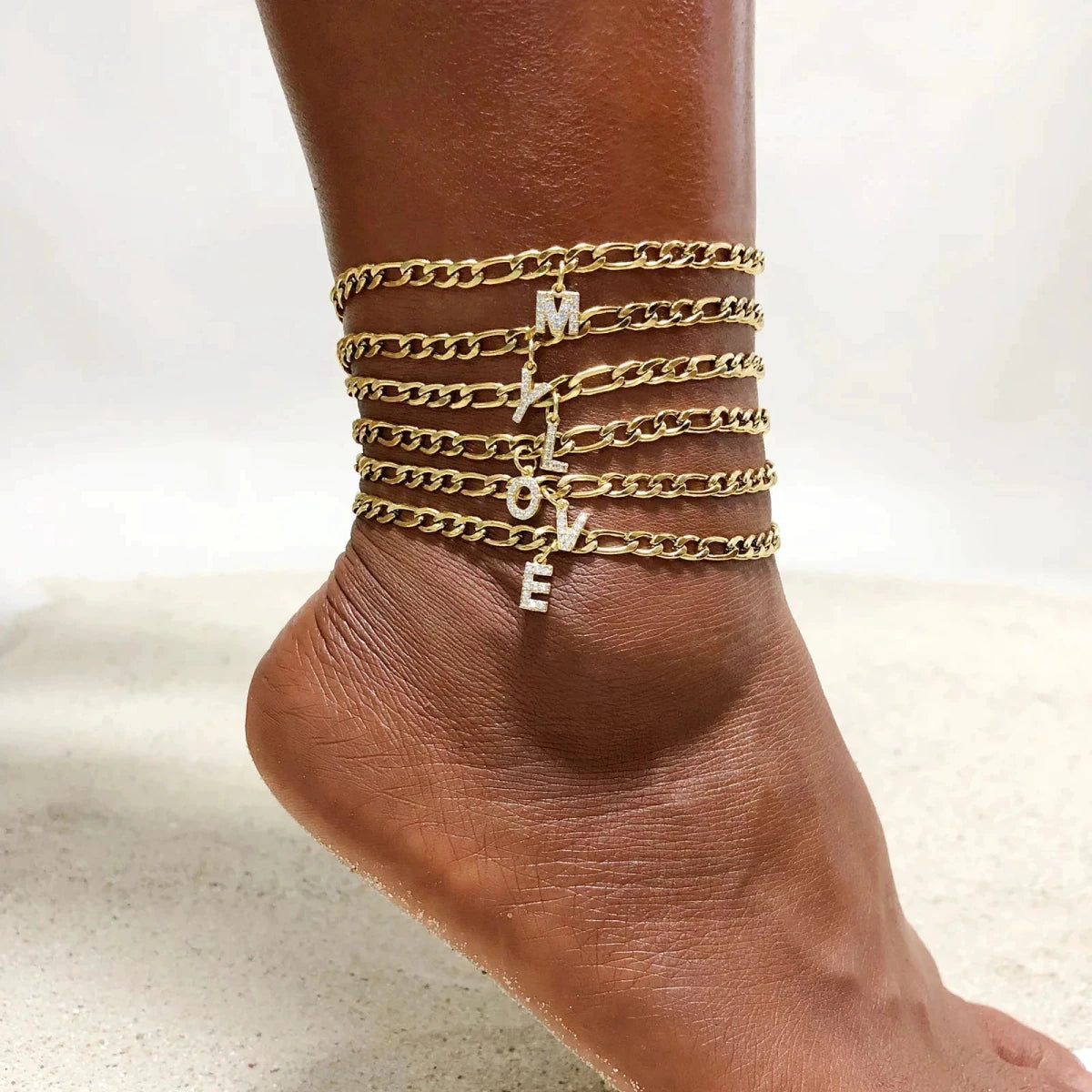 Mandotos crystal A-Z letter initial anklet for women with Cuban link stainless steel design, perfect for beachwear.