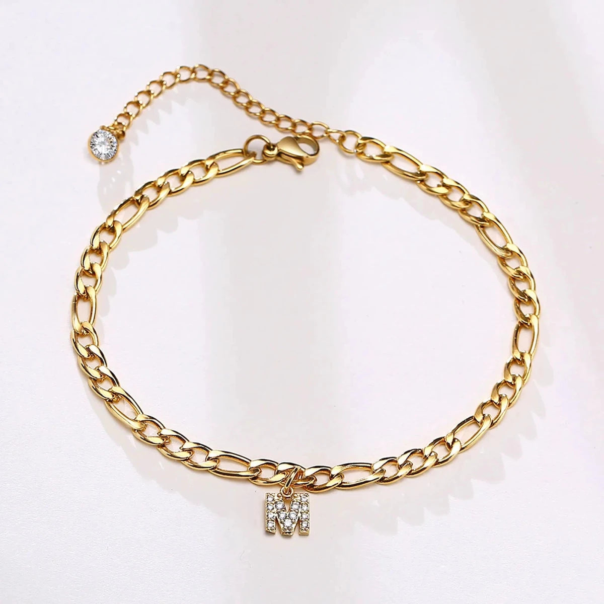 Mandotos crystal A-Z letter initial anklet for women with Cuban link stainless steel design and beach-ready style.